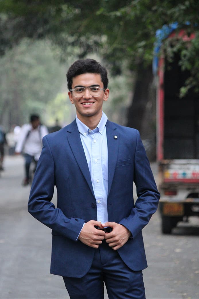 Abhishek Das in a blue suit