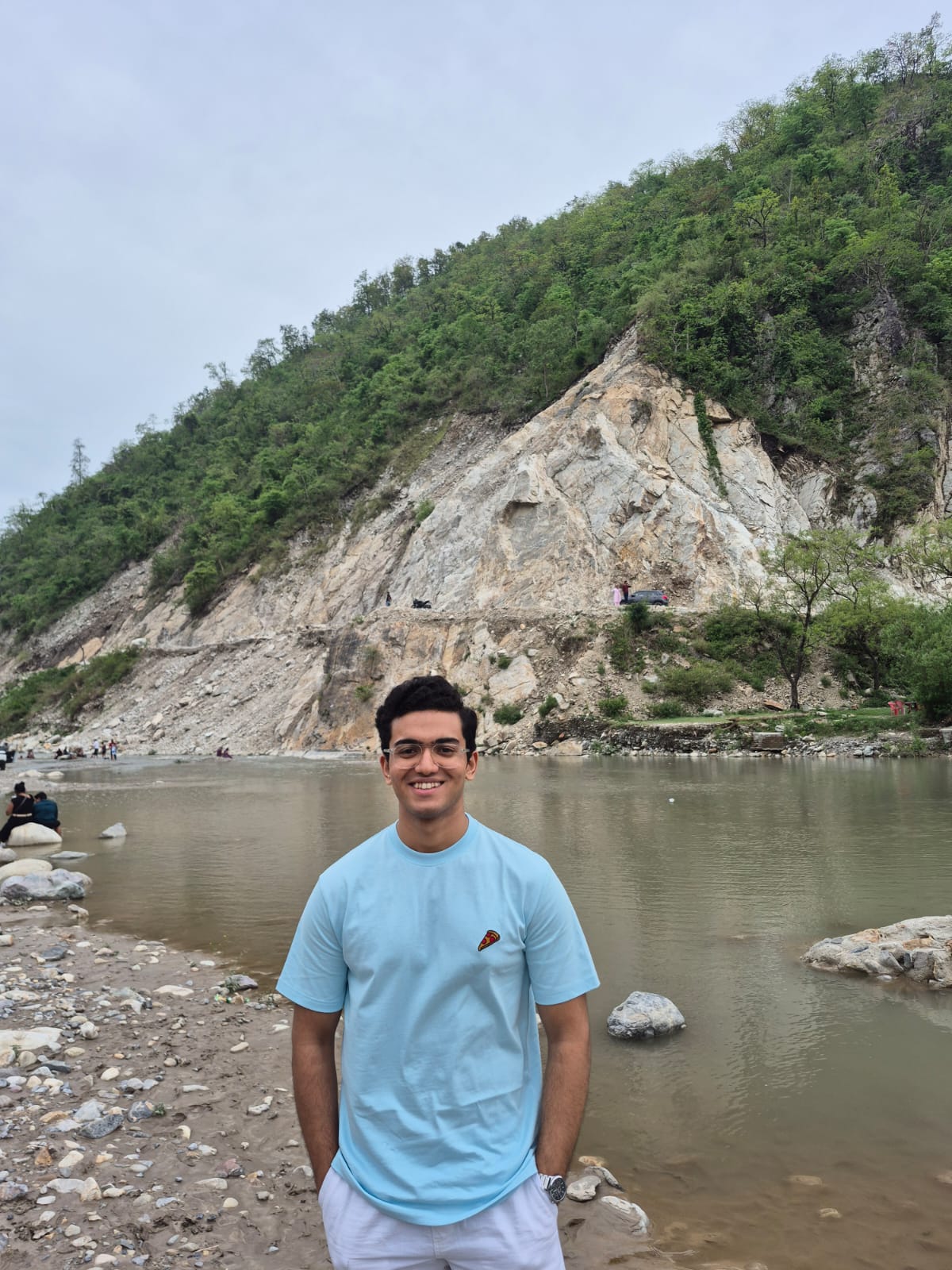 Abhishek Das beside a mountain river